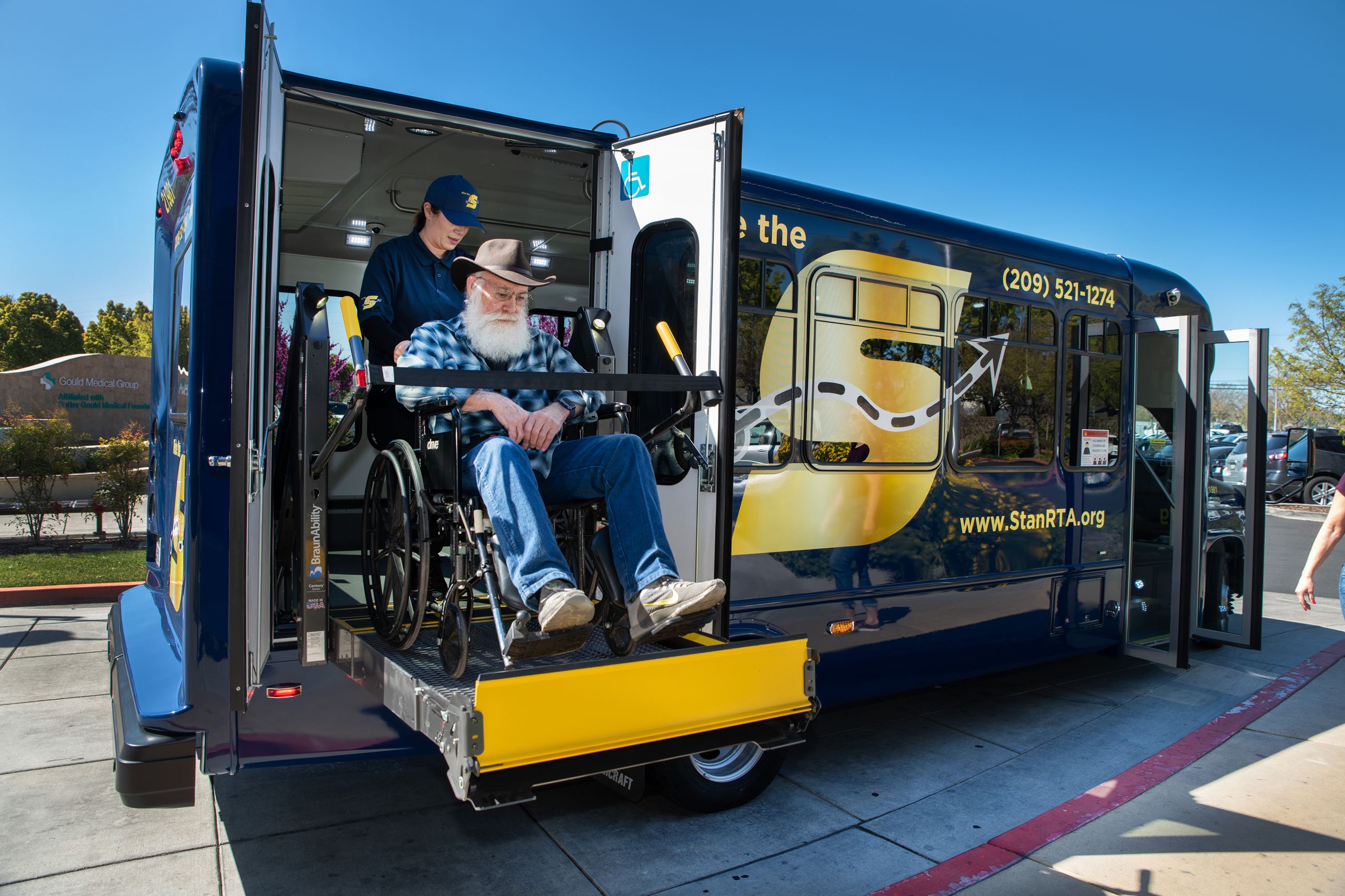 Man in wheelchair on a ramp on a Demand Response vehicle
