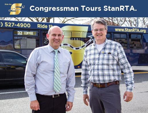 Congressman and StanRTA staff member standing in front of The S bus.